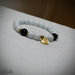 Bracciale perle vetro bianche e nere ciondolo motivo cuore made with love intermezzi metallici