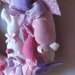 Ghirlanda pasquale con coniglietto ed uova in rosa, lilla, fucsia e panna