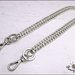 Catena per borsa, diamantata colore argento lunga cm. 130, completa di anelli, moschettoni  e ciondoli cuore