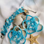 Parure braccialetto e orecchini crochet azzurra con perle