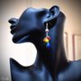 Orecchini pendenti in acciaio argentato con perle vetro satinato colori arcobaleno.