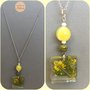 Collana in acciaio e gemme con ciondolo in resina e fiori