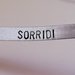 Bracciale "SORRIDI" in alluminio rigido