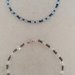Coppia di braccialetti con perline celesti e blu e bianche e argentate  