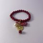 bracciale rosso con varie pietre e zama