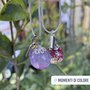 Collana placcata argento con sfera in resina con charm.