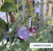 Collana placcata argento con sfera in resina con charm.