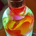 Lampada a forma di bottiglia con rose e foglia d'argento