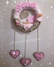 Fiocco tondo con bebè e pendenti rosa