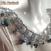 Collier realizzato ad uncinetto con filato gioiello color argento e cristallini azzurri e blu