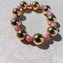 Braccialetto elasticizzato perle dorate e rosa