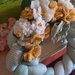 Ghirlanda decorativa in tessuto di cotone con intreccio e fiori in tessuto morbidoso