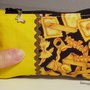 Piccola pochette in stoffa fantasia con zip