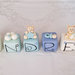 Cake topper cubi con orsetti in scala di blu - 6 cubi 6 lettere