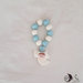 bomboniera comunione rosario con angelo su croce e cuore perlescente bianco e azzurro per bimbo