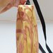 Borsa tracolla tessuto satinato color giallo con disegni e zip