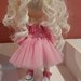 bambola rosa decorativa