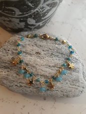 braccialetto dorato con pietre azzurre ed ematite dorata