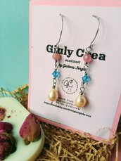 Orecchini donna pendenti, wire, in acciaio inossidabile , con perle in vetro di murano rosa , cristalli swarovski azzurri e perle di fiume.