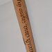 Manganello in legno con scritta. cm 46
