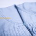 Coprifasce per  neonato in pura lana merino azzurra con laccetti laterali