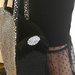Borsa nera in feltro e panno lenci, con paillettes argento, frangia nera laterale e fiori argento decorativi MADE IN ITALY