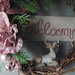 Ghirlanda natalizia con fiori rosa antico