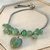 Bracciale “Verde d’Irlanda” in acciaio inossidabile con pendente cuore e pietre di avventurina verde