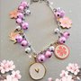 Braccialetto handmade bigiotteria stile giapponese fiori rosa Sakura gru cuore bianco e oro 