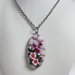 COLLANA IN ACCIAIO INOX CON CIONDOLO OVALE IN FIMO FUCSIA CON FIORI ROSA