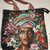 Shopper/tote bag in tessuto gobelin, foderata con cerniera fantasia viso donna