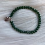 Bracciale elastico con perline verdi e charms