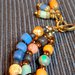 Bracciale multifilo colorato con perline indonesiane