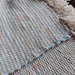 Coppia di tappeti scendiletto color panna tessuti a telaio   VENDUTI