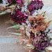 Coroncina_ghirlanda_centrotavola con rami di vite intrecciati e fiori secchi