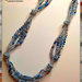 Collana realizzata ad uncinetto con filato gioiello color argento e cristallini sui toni dell’azzurro