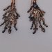 Orecchini pendenti snodati in argento 925 con zirconi e stelle marine