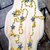 Collana lunga a rosario con cristalli gialli e stelle in zama 