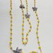 Collana lunga a rosario con cristalli gialli e stelle in zama 
