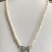 Collana di Perle di Fiume Bianche fiocco decorativo con zirconi 