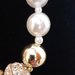 Girocollo perle e sfere dorate con strass