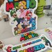 allestimento tavolo compleanno Super Mario Bros personalizza addobbi scatoline regali fine festa