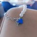 Bracciale perle e cuore blu