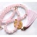 Collana in perle di  quarzo rosa con pendente oro e nappina in seta