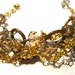 Bracciale con cristalli e catena oro e bronzo