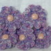 5 fiori in melange lilla e rosa lavorati all'uncinetto.   5 flowers,pink,lilac,melange yarn,crocheted ,supplies