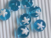 8 perle vetro azzurro con stella bianca 12mm vend.