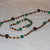 Parure rosario in legno e onice verde