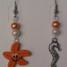 Orecchini con stella marina, cavalluccio marino e perle fimo
