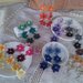 Coppia di orecchini con 3 fiorellini vari colori ad uncinetto in cotone